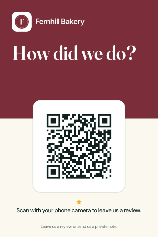 A printed counter card for an example bakery: How did we do? above a QR code, with the line Scan with your phone camera to leave us a review